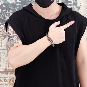 Close-up of vintage gunmetal chunky link bracelet worn by a model in a streetwear style