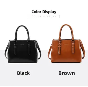 Detail view showing black and brown textured faux leather shoulder bags with strap decor