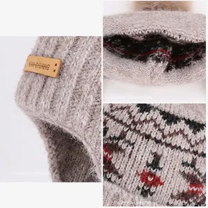Winter knit trapper hat with pom-pom featuring colorful jacquard and warm ear protection