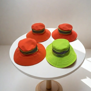 Detail of high-visibility wide brim hats with reflective strips for outdoor safety workers