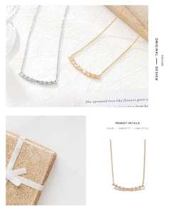 Macro view of minimalist curved bar necklace with baguette-cut zircon in gold and silver