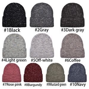 Winter knitted beanies in ten colors featuring colorful speckled patterns and ear protection