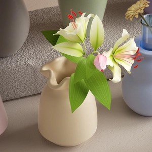 Detail of scalloped edge ceramic vase featuring realistic white lilies and pink buds