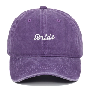 Close-up of white Bride embroidery on purple washed vintage cotton baseball cap