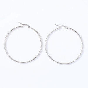 Detailed view of large polished stainless steel hoop earrings with a secure clasp