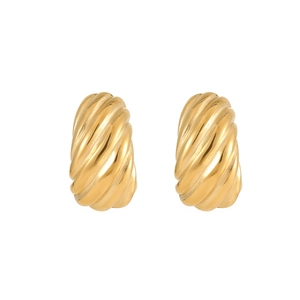 Detailed close-up of golden croissant-shaped hoop earrings with a polished metallic finish