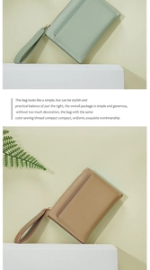 Detail of long zippered wallets in mint green and khaki with lychee leather texture