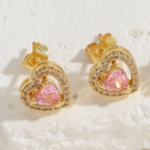 Macro view of 14K gold plated heart earrings with pink zircon and micro-set crystals