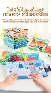 Detail of infant sensory cloth books featuring 3D animal tails and hanging rings