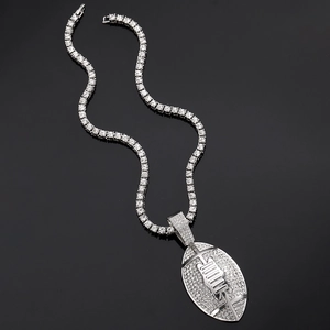 Close-up of iced out silver rugby pendant on a shimmering tennis chain for men