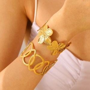 Golden stainless steel cuff bracelets featuring 3D flower and hollow geometric patterns