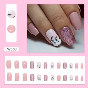 Square nude press-on nails with black leaf silhouettes and glitter accents for women