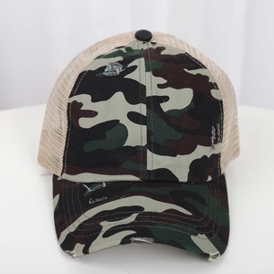 Front view of camouflage ponytail baseball cap with vintage distressed brim and mesh back