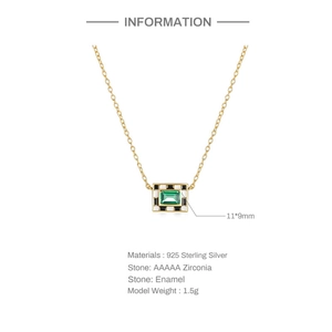 Detail of 925 sterling silver checkerboard pendant with green zircon and enamel inlay
