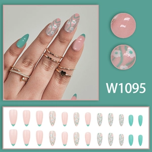 Almond-shaped pale green floral French press-on nails with wave patterns and white flowers