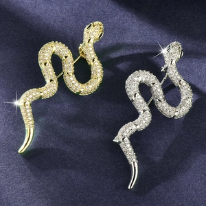 Luxury snake brooch pair in gold and silver finish with sparkling zircon inlay detail