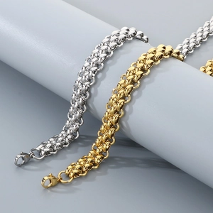 Close-up of gold and silver stainless steel double link chains with lobster clasps