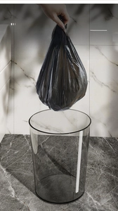 Detailed view of a 16L transparent waste bin showing its modern clear acrylic texture