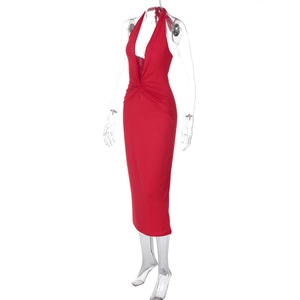Detail of red backless halter midi dress showing smooth fabric and plunging V-neckline