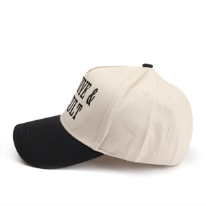 Detail view of the embroidered OVE & ULT text on a two-tone cotton trucker hat
