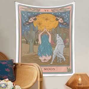 Detail view of The Moon tarot tapestry hanging in a bohemian style room with a rattan chair