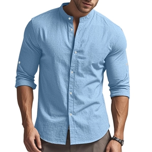 Detail of light blue linen shirt featuring a mandarin collar and adjustable buttoned sleeves