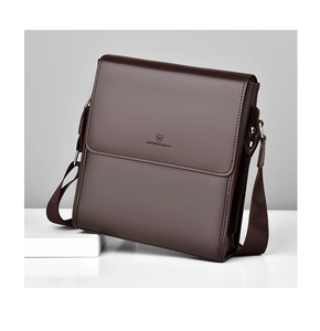 Detail view of brown textured leather crossbody bag with adjustable strap and embossed logo