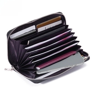 Detail view of the RFID-protected black leather wallet with multiple card slots and phone pocket