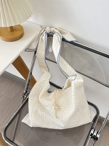 Chic textured cream canvas tote with black polka dots and blue contrast trim details