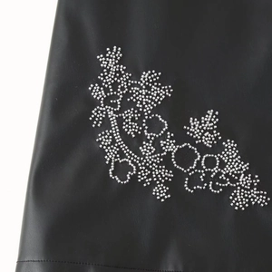 Retro black PU leather mini dress featuring elegant silver beaded patterns and rhinestones