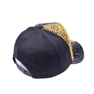 Detail of adjustable snapback buckle and sparkling rhinestones on summer baseball cap