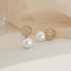 Elegant stainless steel gold earrings with micro-pave diamonds and dangling pearls