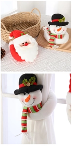 Detailed view of plush Santa and Snowman curtain buckles for festive home decor