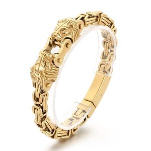 Men's punk style double lion head gold stainless steel thick chain bracelet on white background