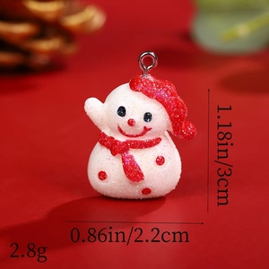 Detailed view of snowman resin pendant with red glitter accents and product dimensions