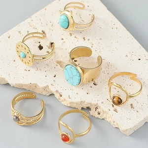 Set of bohemian stainless steel open rings with turquoise and natural stones in gold finish
