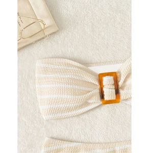 Detail of striped seersucker bikini top with textured fabric and amber square buckle