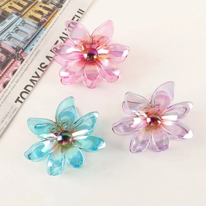 Iridescent flower hair claw clips in pink, blue, and purple for women with elegant resin finish