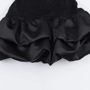 Fashionable black lace and satin mini dress with elegant textured pleats and ruffled design
