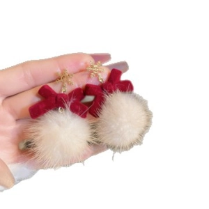 Elegant gold snowflake earrings with red velvet bows and soft white pom-pom drops