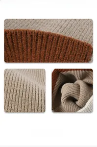 Close-up of color-block knit beanie showing brown and beige rib-knit texture and seams