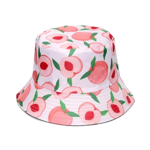 Close-up of white sun hat featuring all-over peach patterns with green leaves