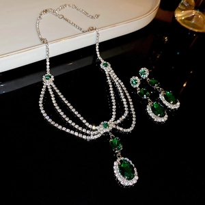 Detailed view of emerald green zircon necklace and matching waterdrop earrings set
