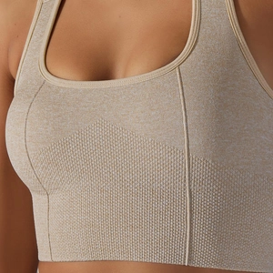 Detail of heather beige seamless sports bra showing knit texture and square neckline