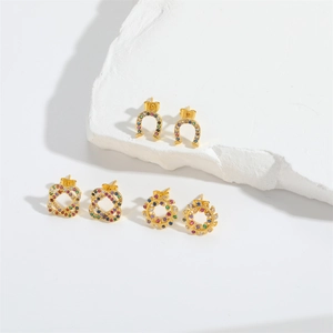 Vintage gold stud earrings with colorful zircon stones in horseshoe and floral shapes