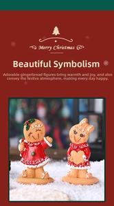 Close-up of resin gingerbread man and woman figurines with festive Christmas snow background