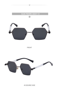 Detail of gunmetal grey hexagonal sunglasses with metal frames and grey lenses
