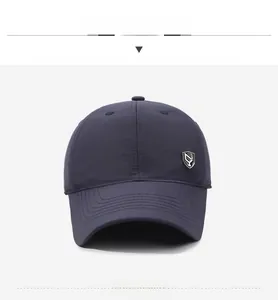 Front view of navy blue thermal baseball cap featuring a decorative silver shield logo