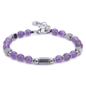 Detailed macro view of purple beaded bracelet with silver hexagonal metal accent and clasp