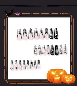 Detail of Halloween coffin nails featuring spider web, ghost skull and moon patterns